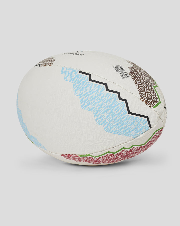 Harlequins supporters rugby ball with multicolored geometric patches on a white surface