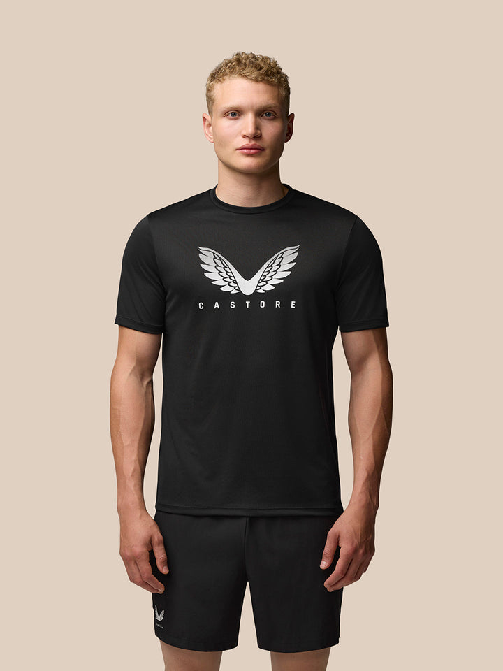 Male model wearing black Adapt Training T-Shirt with Castore wings graphic on the chest