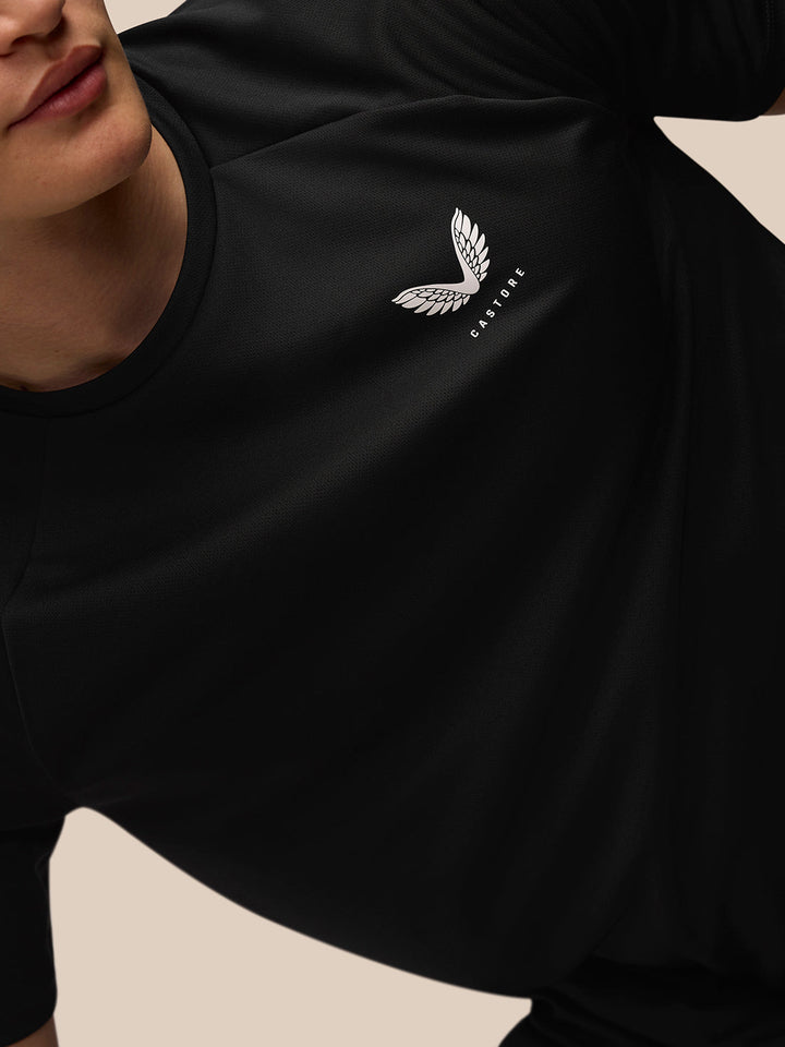 Close-up of a black Adapt Training T-Shirt showing Castore branding on the left chest and upper back.