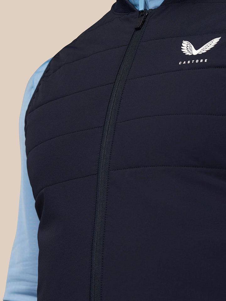 Close up of navy Apex Training Gilet zipper with Castore logo on the chest