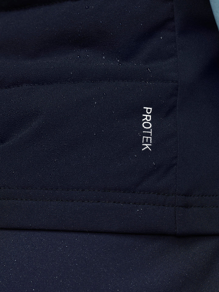 Close up of navy Apex Training Gilet fabric with ProTek branding on the chest