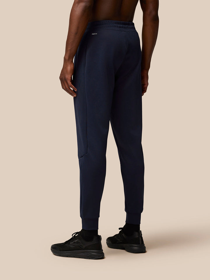 Back view of navy Flex Lifestyle Joggers with Protek branding at the rear waistband.