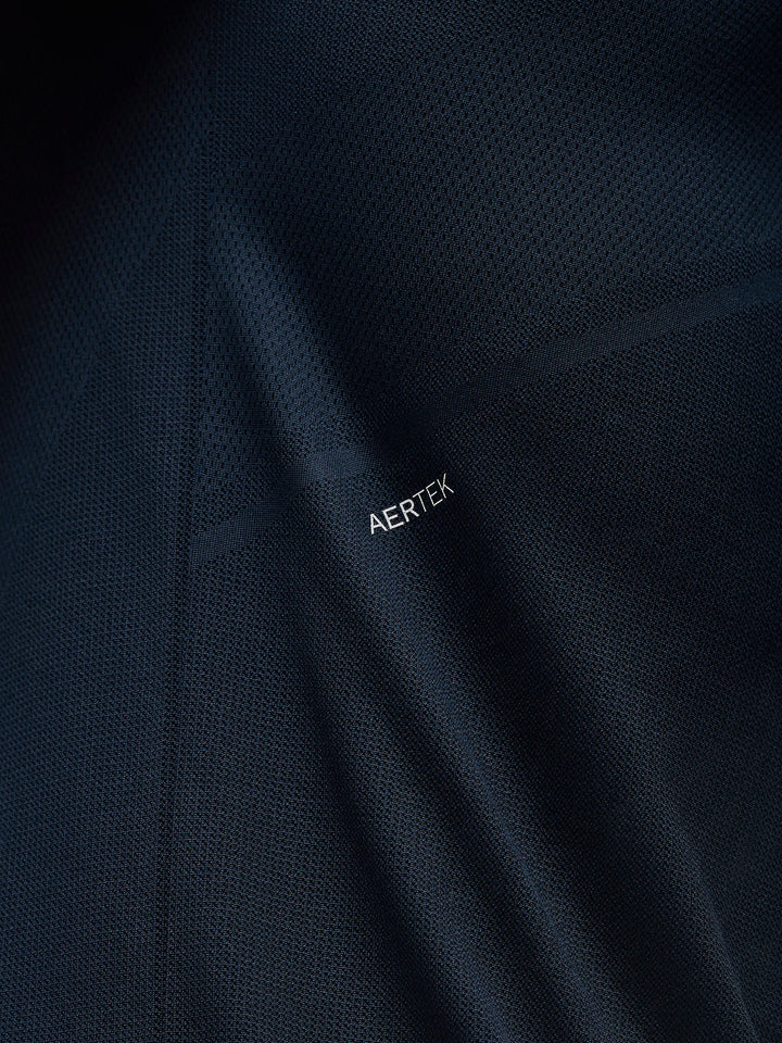 Close-up of navy Apex Training T Shirt fabric with AERTEK branding.