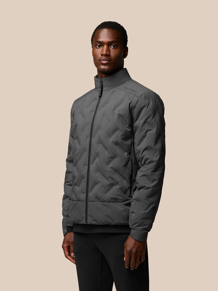 Male model wearing Charcoal Quilts Lifestyle Jacket with stand collar and full front zip
