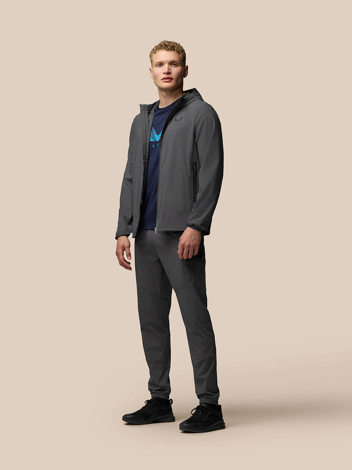 Close-up of charcoal Lightweight Flex Jacket chest showing left chest branding and zip front