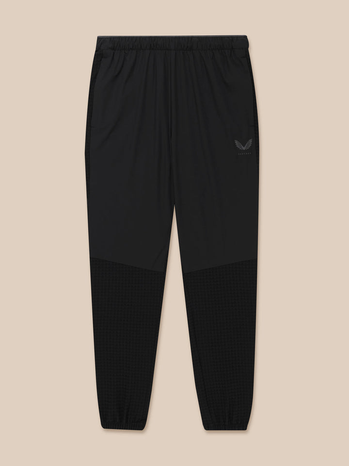 Flex Winterised Woven Joggers in black with elastic waistband, zipped pockets, and Castore logo on the left thigh