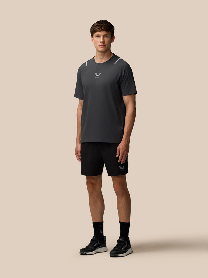 Male model wearing Apex Training 6 inch shorts in black with Castore logo on the left leg