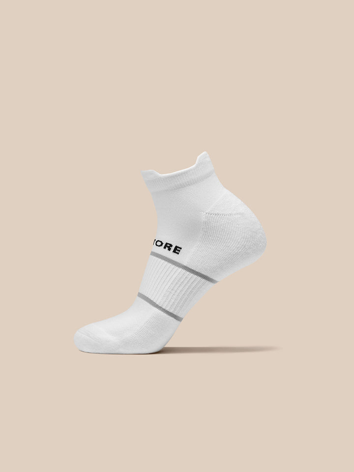 Single white ankle length Active Training Sock with Castore branding and gray stripe near the cuff