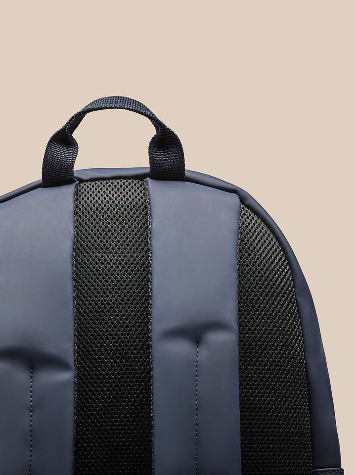 Top handle and padded back panel of the navy Active Small Backpack