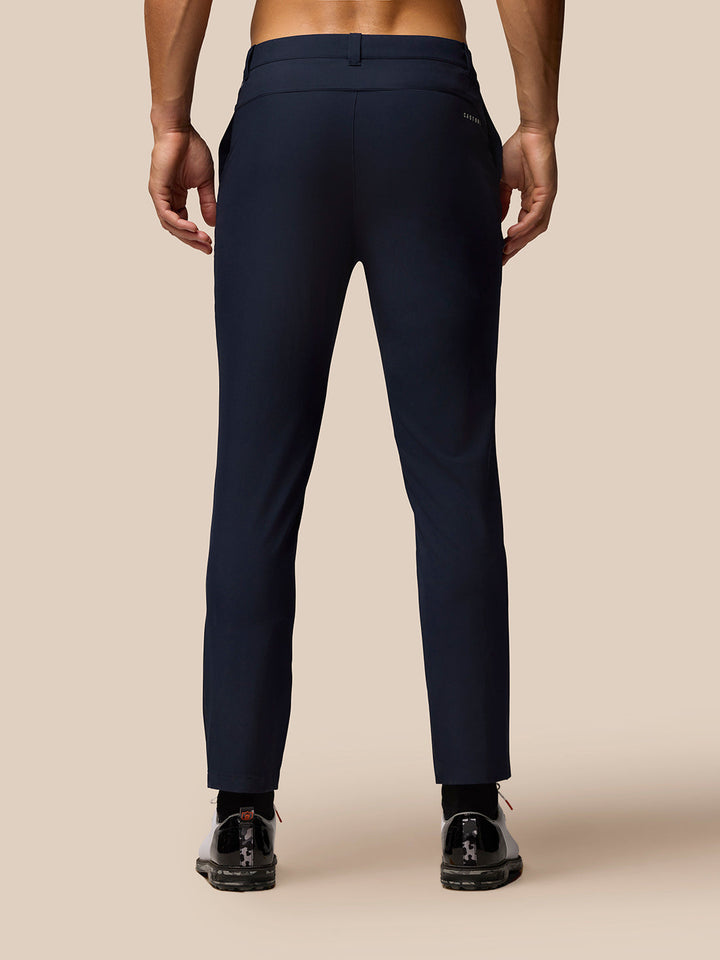 Back view of Midnight Navy golf trousers showing rear pockets and branding.