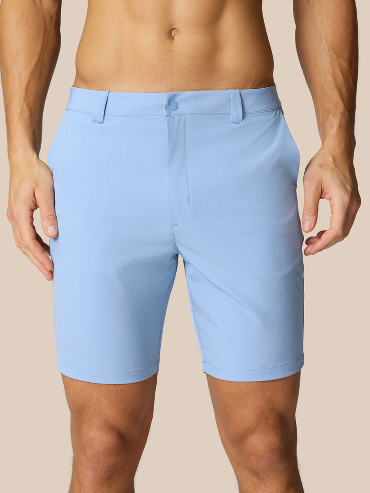 Light blue Golf Shorts with belt loops and side pockets shown on a model from the back.
