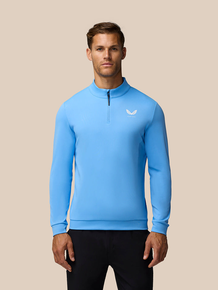 Man wearing Cool Blue Golf Club Classic 1/4 Zip Top with funnel collar and chest logo