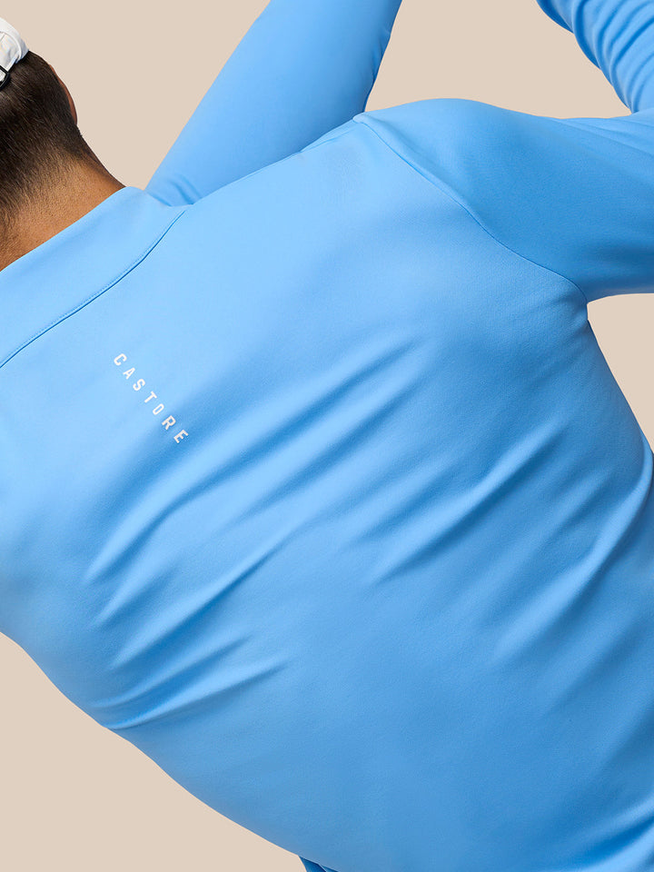 Back view of blue Golf Club Classic 1/4 Zip Top showing Castore logo on the left back