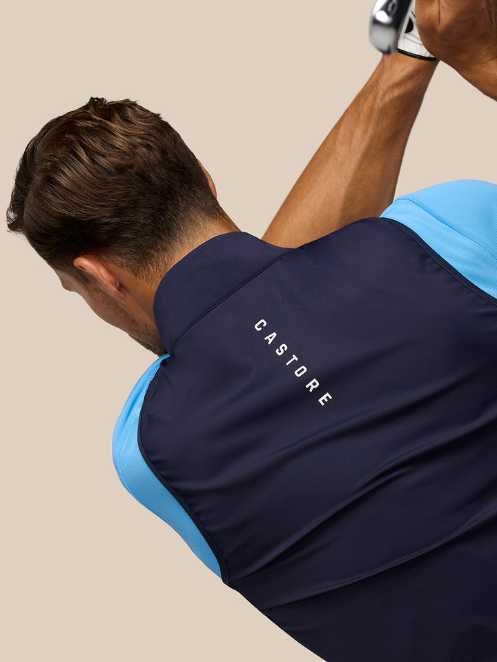 Back view of navy Pinnacle gilet with CASTORE lettering running down the back