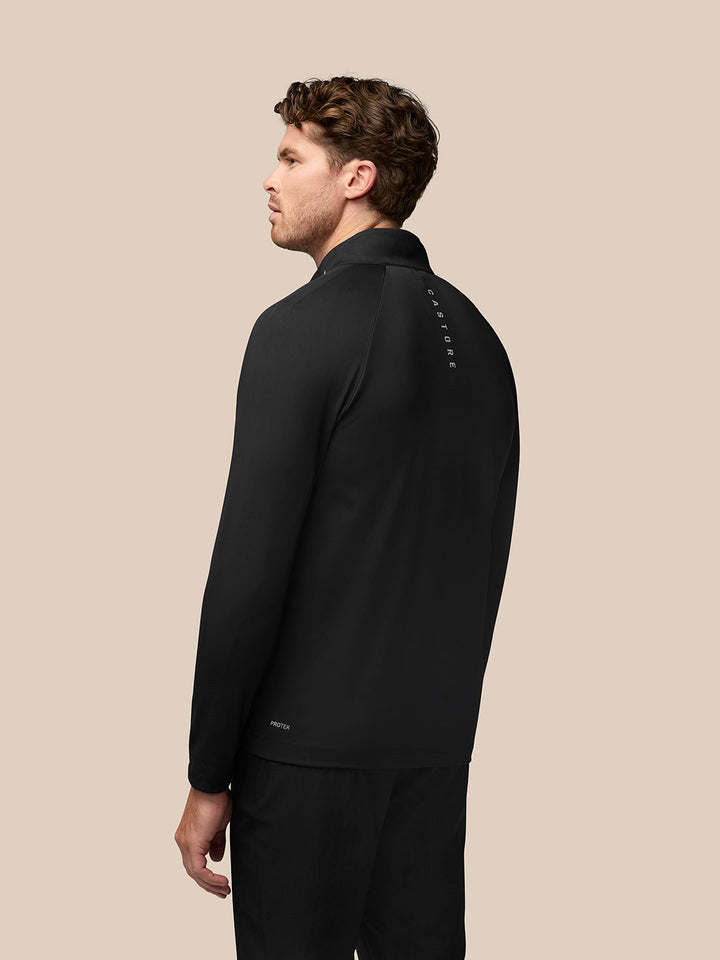 Back view of black Golf Pinnacle Jacket showing Castore text along upper back