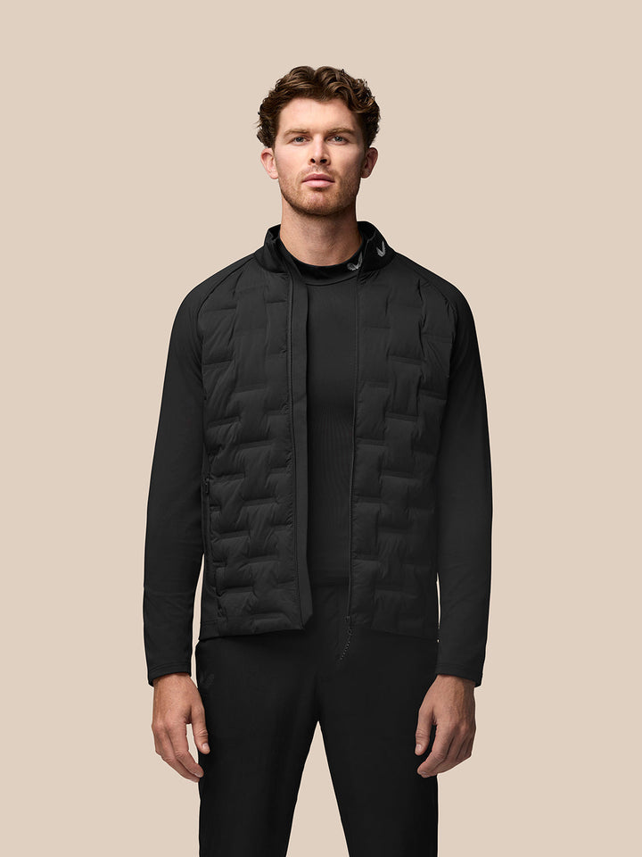 Front view of black Golf Pinnacle Jacket with quilted front panels and stand collar