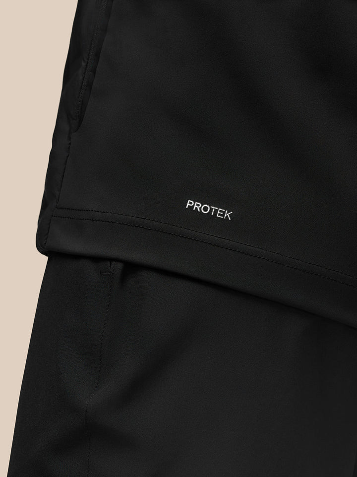 Protek branding on the hem of the black Golf Pinnacle jacket