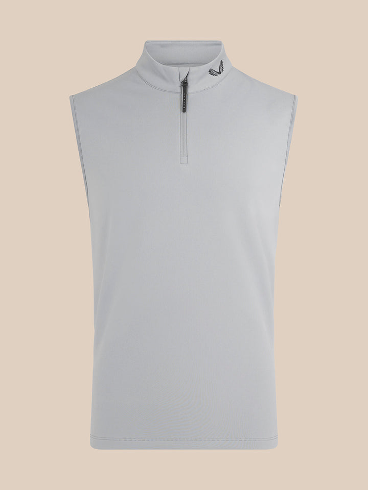 Beige sleeveless golf gilet with high collar and half zip, Castore branding at the neck.