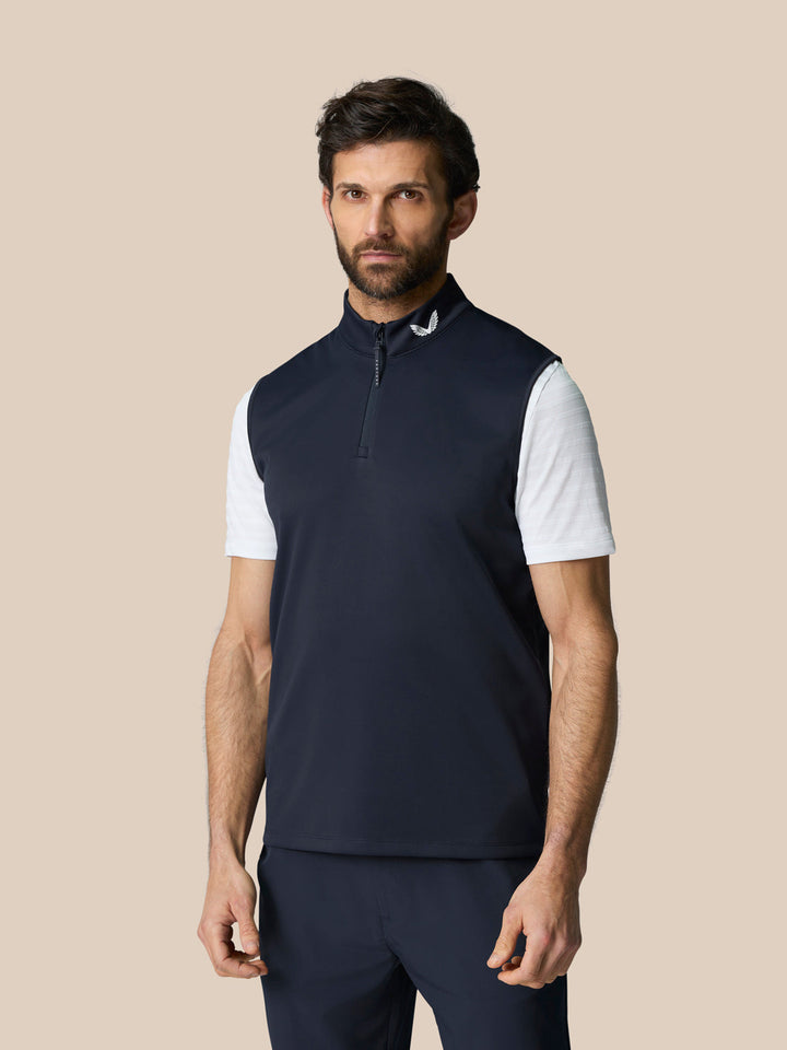 Front view of navy Club 1/2 Zip Gilet with high neck and sleeveless design, Castore logo at the neckline