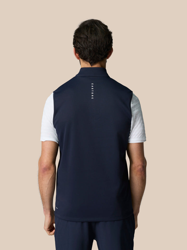 Back view of navy Club 1/2 Zip Gilet with sleeveless cut and Castore graphic on upper back