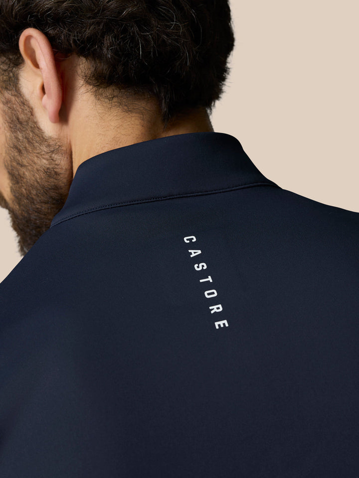 Back view of navy Club 1/2 Zip Gilet with Castore branding along the neck