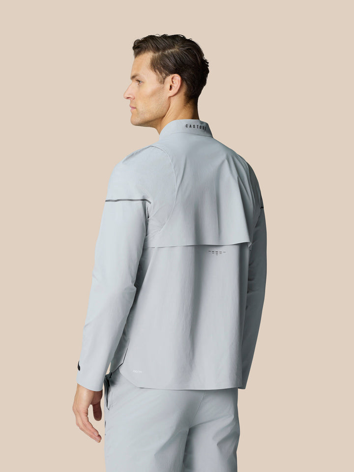Back view of the light grey Golf Pinnacle LVS Woven Jacket showing collar detail and vented back panel