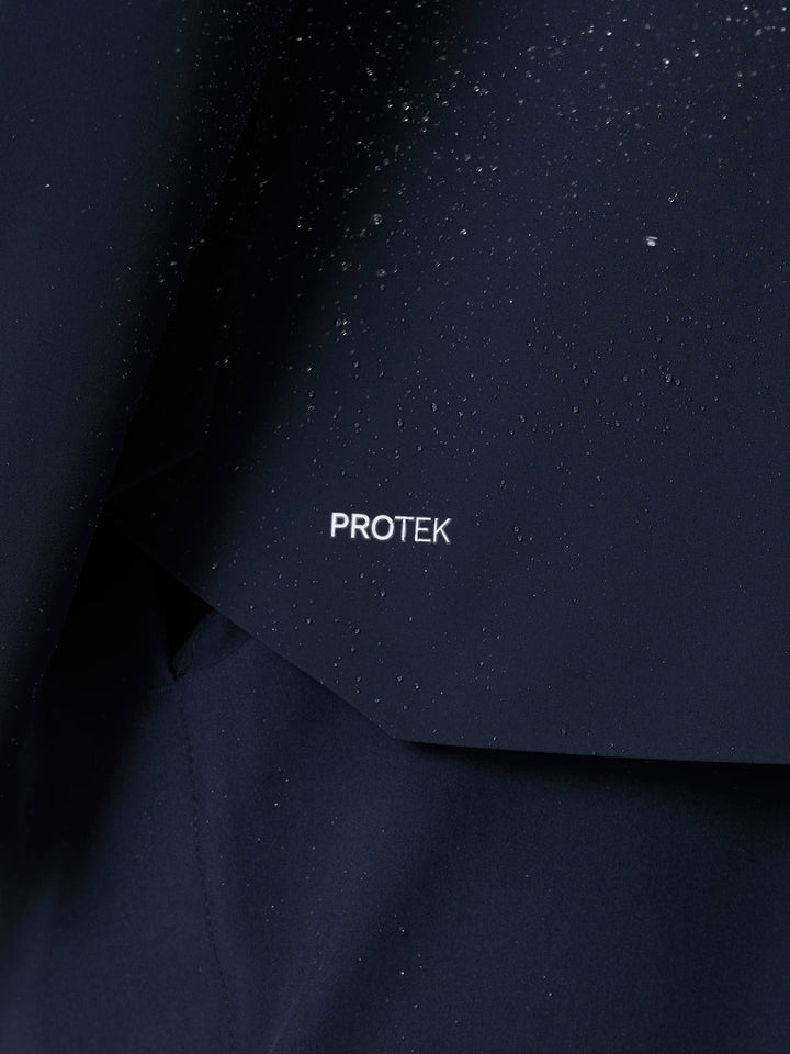 ProTek water resistant fabric close-up with droplets on navy jacket surface