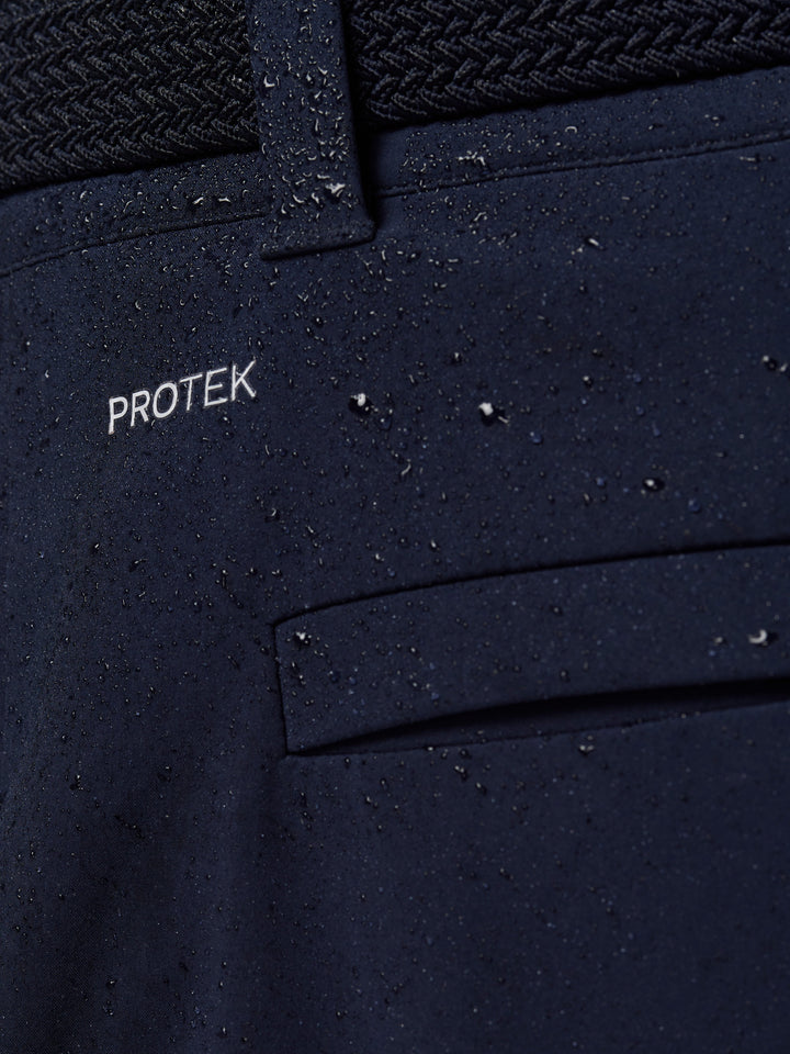 Close-up of navy ProTek fabric with water droplets illustrating water resistance