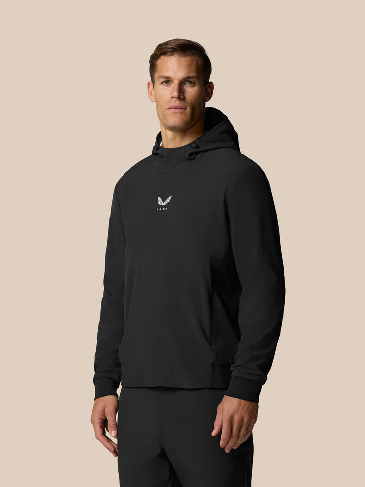 Man wearing black Golf Pinnacle Performance Hoodie with hood and small chest logo.
