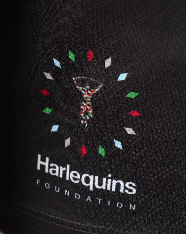 Back of Harlequins 2026/27 Big Game 18 replica shirt showing flowing multicolor Flux graphic on black fabric