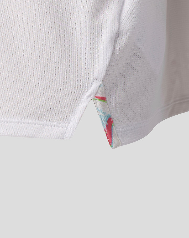 Close-up of white Harlequins junior 2026/27 matchday T shirt fabric with breathable mesh and a colorful side slit detail