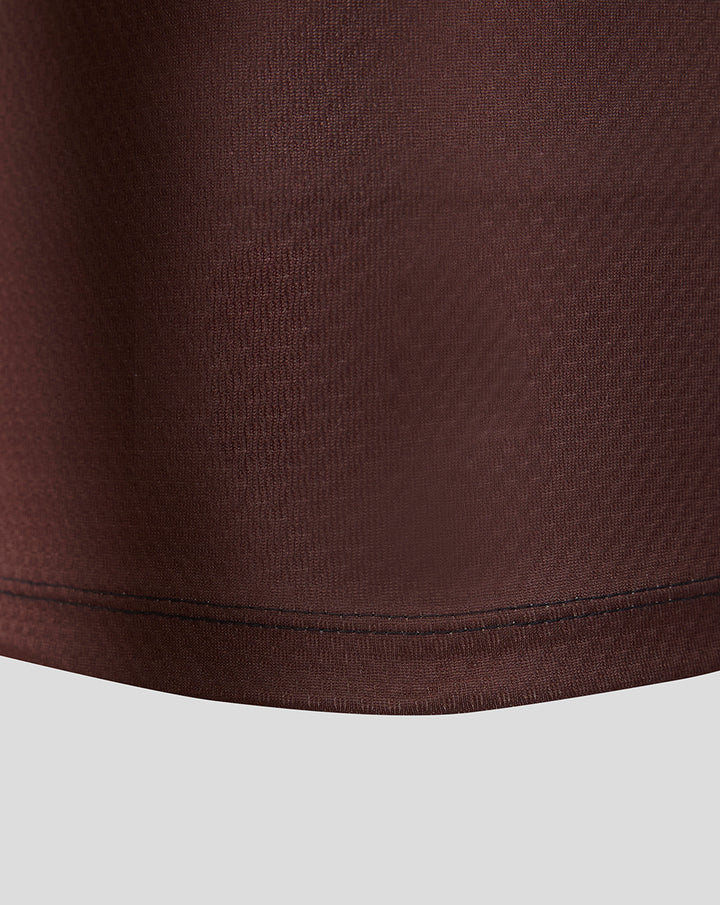 Close up of the maroon fabric and hem on the Harlequins 2026/27 home pro shirt
