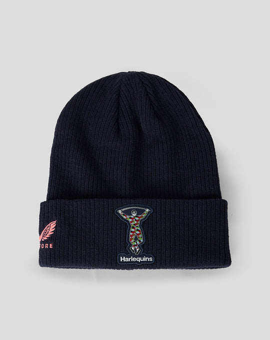 Harlequins navy knit beanie with folded cuff, crest patch on the front, and pink wing embroidery on the side.