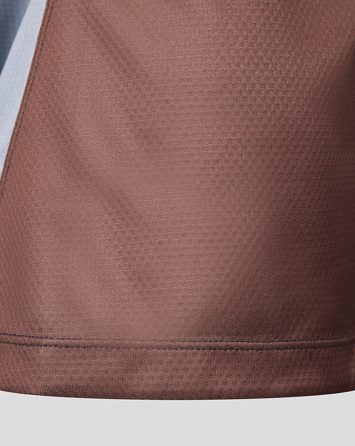 Close-up of brown textured fabric and hem on the Harlequins Womens Home Pro Shirt