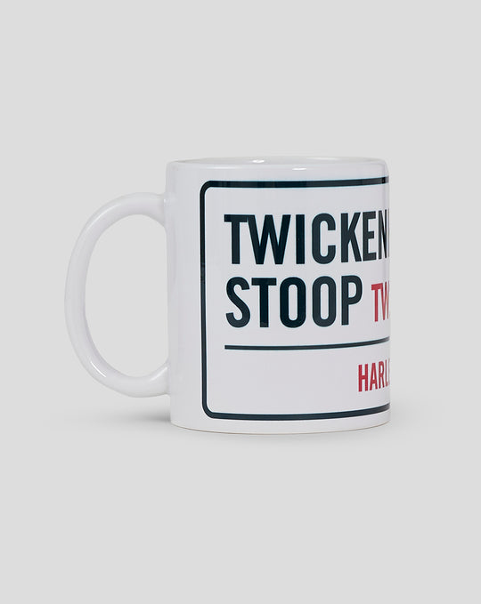 White Harlequins mug with road sign motif showing Twickenham Stoop TW2 and Harlequins logo.