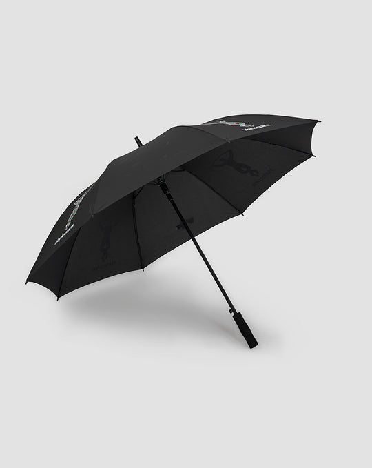 Harlequins golf umbrella in black with crest design visible on canopy.