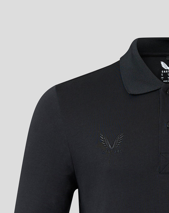 Close up of chest on black Harlequins polo showing tonal Harlequins crest and Castore branding