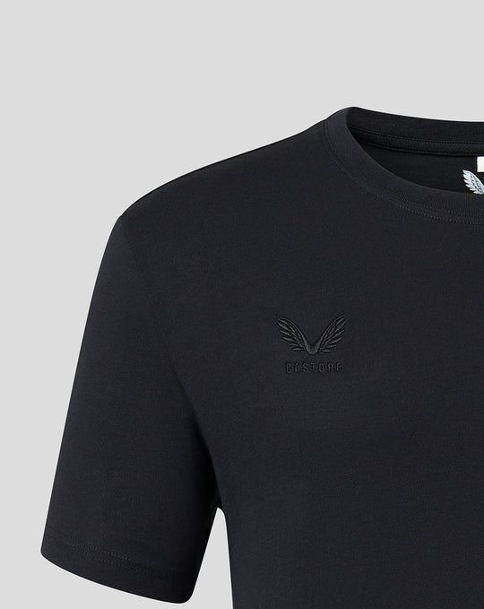 Close up of black T shirt chest with tonal embroidered Harlequins crest and Castore branding