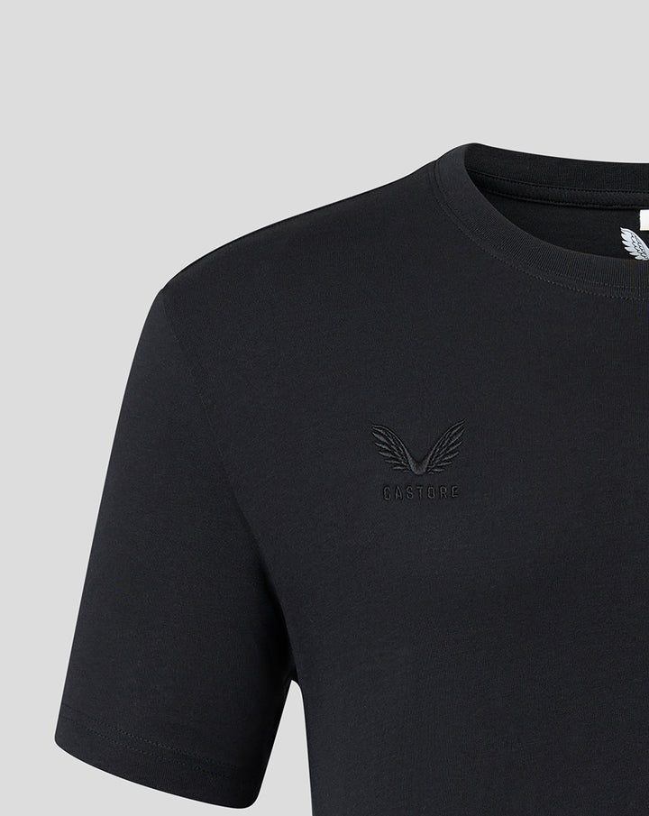 Close up of black T shirt chest with tonal embroidered Harlequins crest and Castore branding