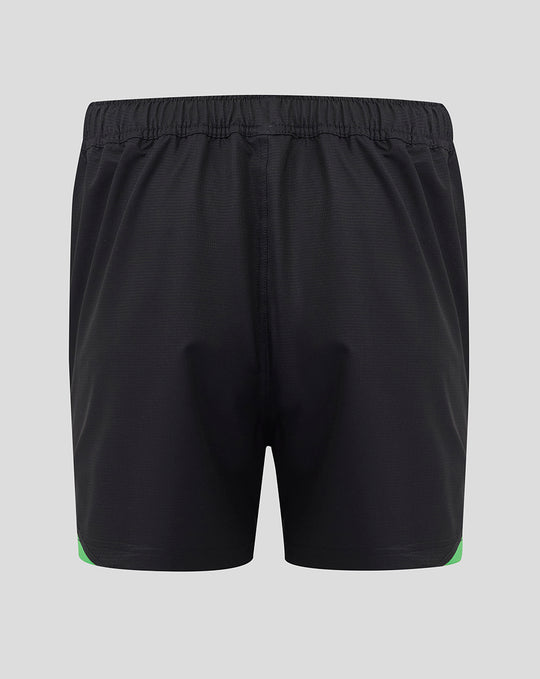Back view of black Harlequins shorts with elastic waistband and green trim at the leg openings.