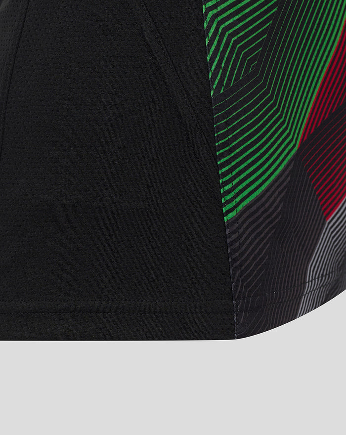 Lower side view of the matchday sleeveless tee showing black bodice and vibrant green red and blue striped panel.