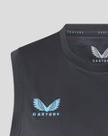 Close-up of ebony training vest neckline with light blue Castore logo and club crest.
