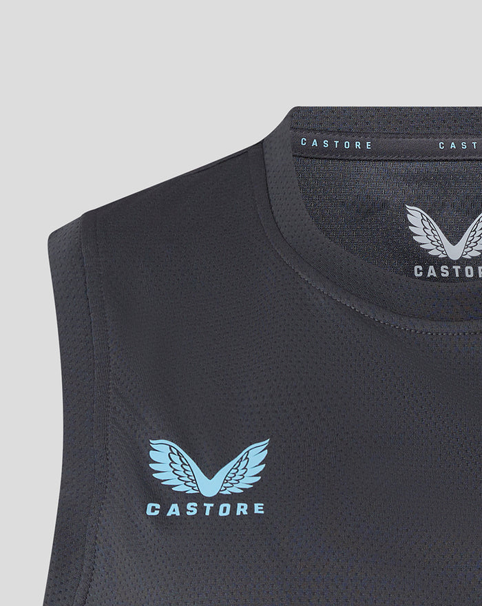 Close-up of ebony training vest neckline with light blue Castore logo and club crest.