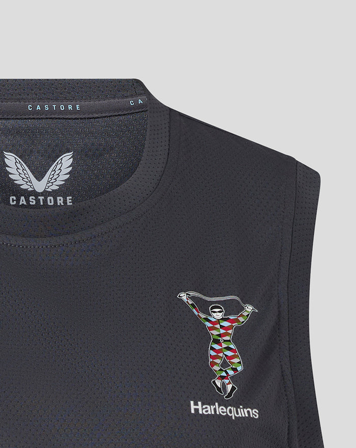 Close up of the dark mesh vest highlighting Castore branding at the neck and the Harlequins crest.