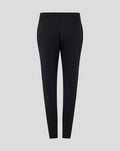Back view of black women's training knit pants with elastic waistband and subtle side pockets