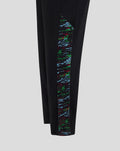 Close-up of the lower leg showing a multicolored abstract side panel on black Harlequins pants