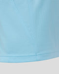 Close up of light sky blue breathable fabric with a stitched seam from the junior training short sleeve tee