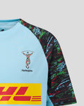 Close-up of junior sky blue Harlequins training tee with crest on chest and colorful patterned sleeve
