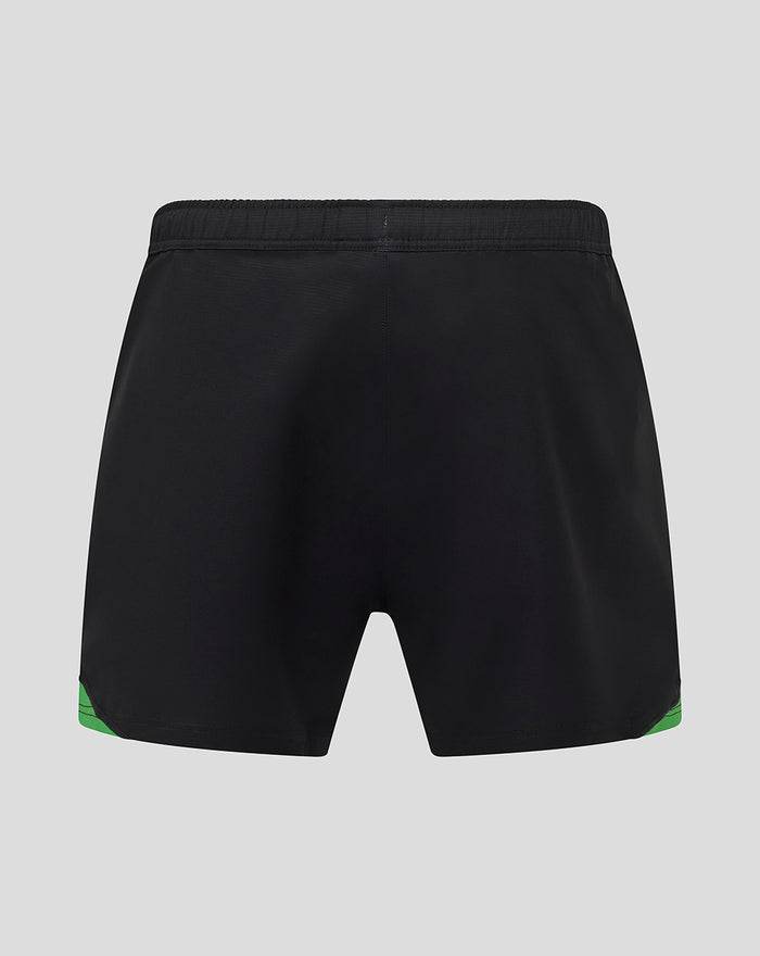Back view of black Harlequins home shorts with green hem accents.