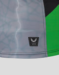 Hem detail of Harlequins replica shirt with grey panel and green trim beside the Castore authenticity badge